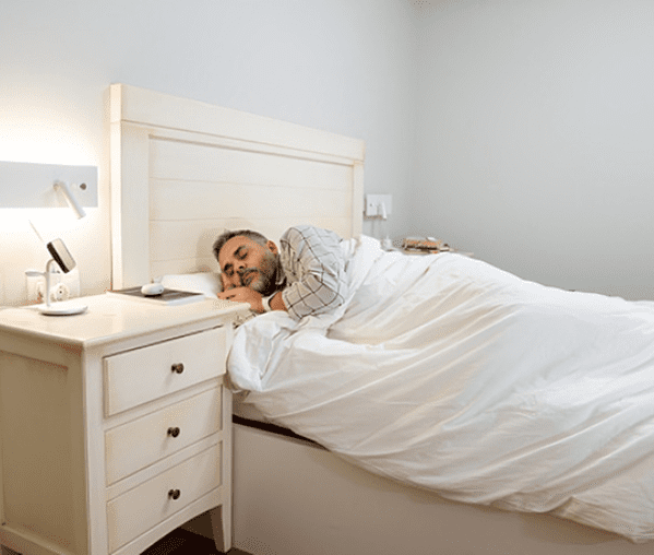 Man sleeping peacefully in bed